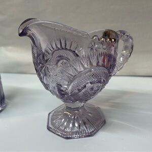 Antique EAPG Slewed Horseshoe purple creamer .  No damage